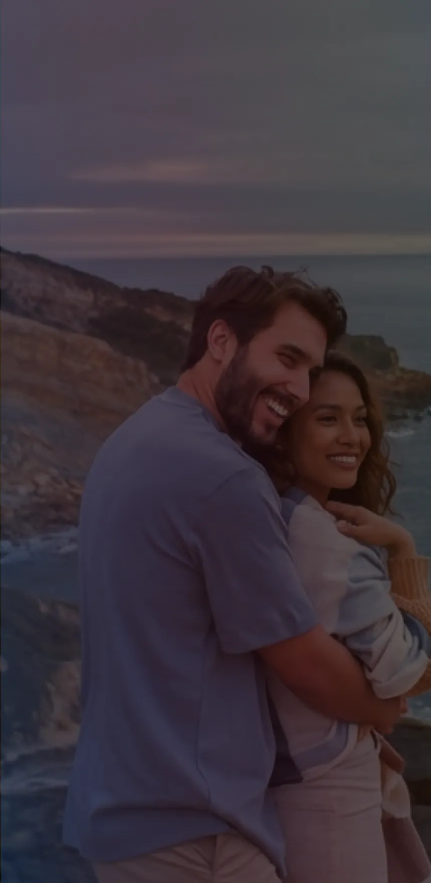 Couple embracing at sunset